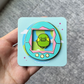 "Alien" pet pin with turquoise "Cotton Candy" shell pin variant.
